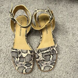 Lucky Brand Snake Print Sandal. Block heel. Leather upper.